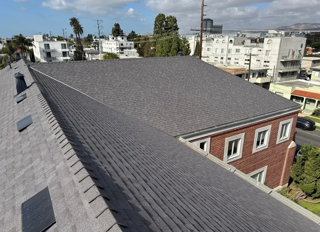 Licensed roofer installing weather-resistant materials on a Glendale commercial building rooftop